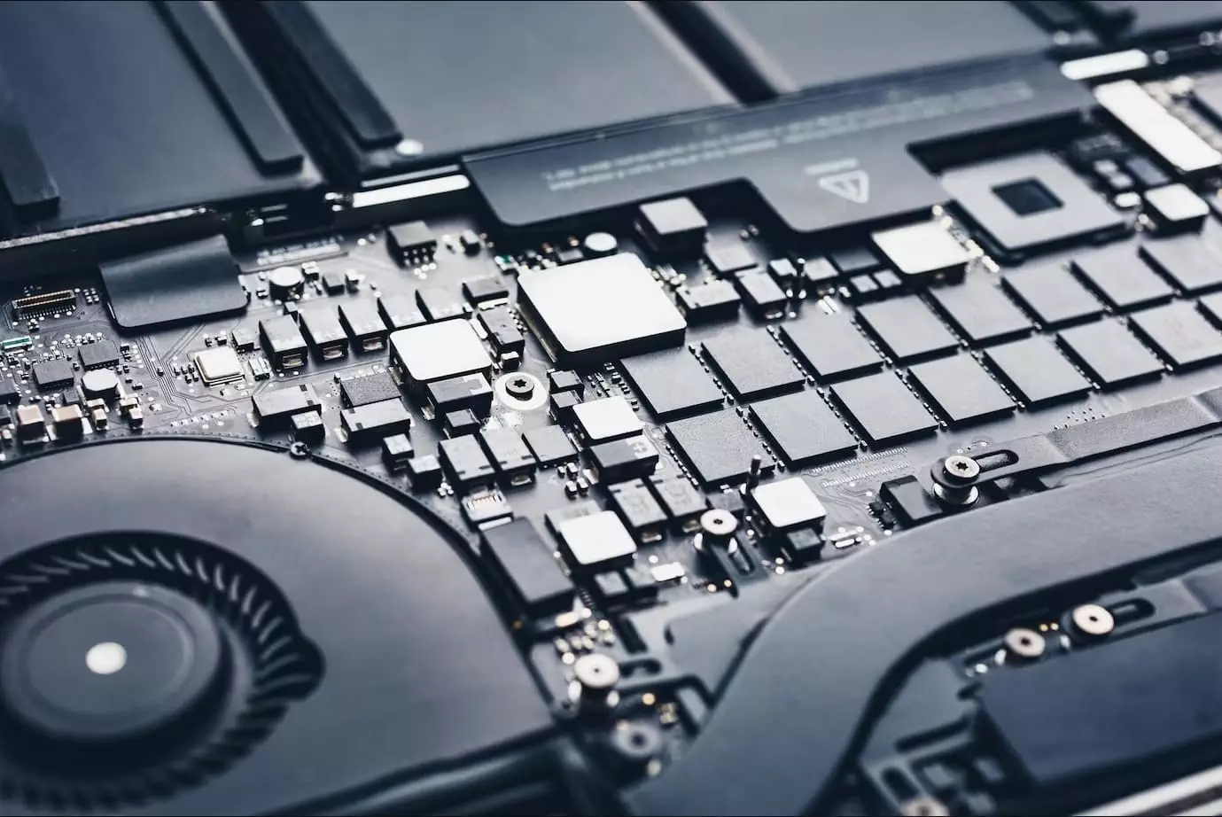 Showing the internal components and chips of a laptop.